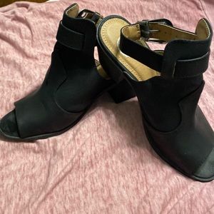 Woman’s black sued heel size: 7